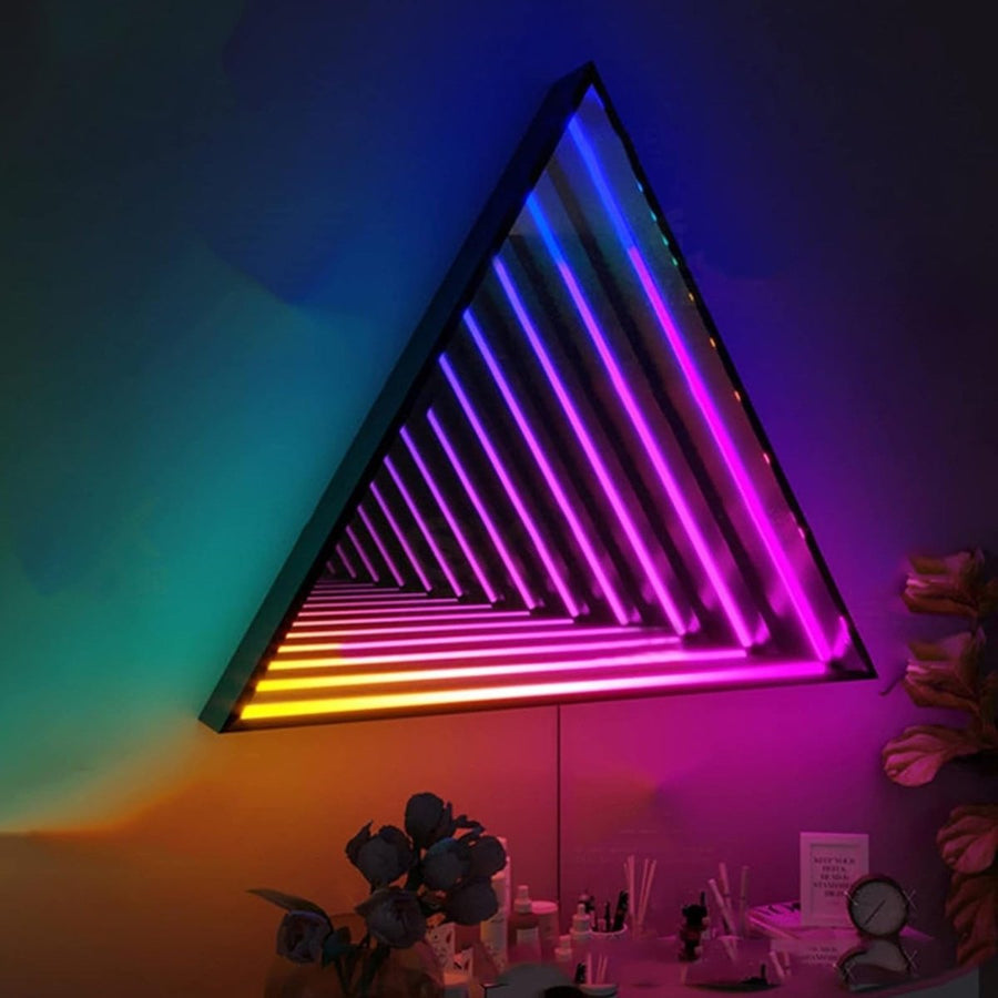 The Maytrix Triangle Infinity Mirror features customizable lighting in blue, purple, pink, and yellow. Its modern tunnel illusion design is perfect for hanging above a desk decorated with flowers and decor or storing small items beneath.